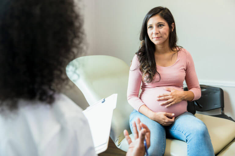 pregnant woman with her OBSTETRICIANS