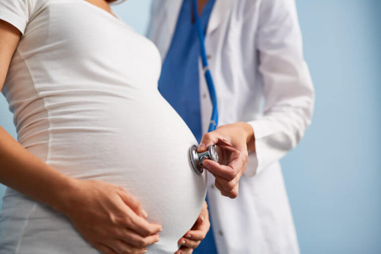 obstetrician checking the pregnant lady