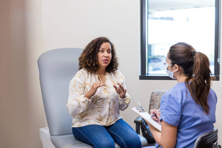 Patient Telling Her problems To Doctor